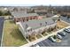 Aerial view of brick townhomes with ample parking in a well-maintained community at 1205 Skywatch Ln, Monroe, NC 28112