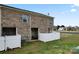 Backyard with a white fence and small patio at 1205 Skywatch Ln, Monroe, NC 28112