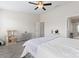 Light and airy bedroom with ceiling fan and neutral-colored walls and carpet at 1205 Skywatch Ln, Monroe, NC 28112