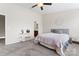 Cozy bedroom with neutral walls, ceiling fan, carpeted floors, and a comfortable bed at 1205 Skywatch Ln, Monroe, NC 28112