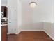 Bright dining room showcasing hardwood floors and an open layout adjacent to the kitchen at 1205 Skywatch Ln, Monroe, NC 28112