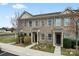Attractive brick townhomes feature well-kept landscaping and inviting front entrances at 1205 Skywatch Ln, Monroe, NC 28112