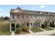 Charming brick townhome with well-manicured landscaping and a welcoming entrance at 1205 Skywatch Ln, Monroe, NC 28112
