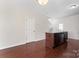 Open-concept kitchen features a large island with a sink and dark wood cabinets at 1205 Skywatch Ln, Monroe, NC 28112
