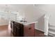 Island in the kitchen featuring wooden cabinets, granite countertop and stainless sink at 1205 Skywatch Ln, Monroe, NC 28112