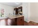Well-lit kitchen with a large island, stainless steel appliances, and dark wood cabinetry at 1205 Skywatch Ln, Monroe, NC 28112