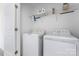 Laundry room features a white washer and dryer, and wire shelving at 1205 Skywatch Ln, Monroe, NC 28112