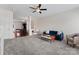 Spacious living room with plush carpet, ceiling fan, and ample natural light at 1205 Skywatch Ln, Monroe, NC 28112