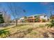 Large backyard with a white fence, deck, and a backdrop of mature trees offers a private outdoor retreat at 125 Rocky Trail Ct, Fort Mill, SC 29715