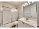 Bathroom featuring a shower and tub with sliding door, a toilet, and a white single sink vanity at 125 Rocky Trail Ct, Fort Mill, SC 29715