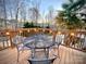 Cozy deck with an outdoor dining set, perfect for enjoying scenic backyard views at 125 Rocky Trail Ct, Fort Mill, SC 29715