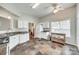 Bright, airy kitchen featuring white cabinetry, stainless steel appliances, and tile flooring at 125 Rocky Trail Ct, Fort Mill, SC 29715