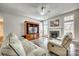 Inviting living room with fireplace, media center, neutral decor, and beautiful tile flooring at 125 Rocky Trail Ct, Fort Mill, SC 29715