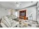 Comfortable living room featuring neutral decor, tile floors, and a media center for entertainment at 125 Rocky Trail Ct, Fort Mill, SC 29715