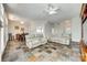 Open living area with tile floors, neutral couches, dining area, and plenty of natural light at 125 Rocky Trail Ct, Fort Mill, SC 29715