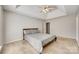 Spacious carpeted main bedroom featuring a vaulted ceiling, ceiling fan, and neutral colors at 125 Rocky Trail Ct, Fort Mill, SC 29715