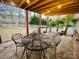 Inviting covered patio with stone flooring and cozy outdoor seating area for relaxation at 125 Rocky Trail Ct, Fort Mill, SC 29715