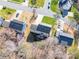 Aerial view of a home featuring a backyard deck and proximity to mature trees in a residential area at 12642 Cardinal Woods Dr, Pineville, NC 28134