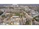 Aerial view of the neighborhood with tree coverage and Piedmont Medical Center in the background at 142 Westerwood Dr, Rock Hill, SC 29732