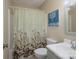 Neutral bathroom featuring a vanity with solid surface top, toilet, and a shower-tub combo with decorative shower curtain at 142 Westerwood Dr, Rock Hill, SC 29732