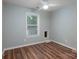 Bright bedroom featuring modern flooring, a ceiling fan, and neutral-toned walls at 142 Westerwood Dr, Rock Hill, SC 29732