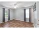 Inviting bedroom with wood-look floors, a ceiling fan, and natural light at 142 Westerwood Dr, Rock Hill, SC 29732