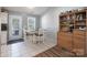 Bright dining area featuring tile floors, a classic hutch, and ample natural light at 142 Westerwood Dr, Rock Hill, SC 29732