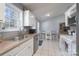 Well-lit kitchen featuring stainless steel appliances, and a view to the outdoor dining area at 142 Westerwood Dr, Rock Hill, SC 29732