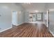 Spacious living room with wood floors flowing into a bright kitchen and a back door at 142 Westerwood Dr, Rock Hill, SC 29732