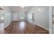 Open-concept living room featuring wood floors, light blue walls, and lots of natural light at 142 Westerwood Dr, Rock Hill, SC 29732