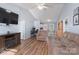 Spacious living room featuring hardwood floors, a high ceiling, and open access to the dining area at 142 Westerwood Dr, Rock Hill, SC 29732