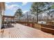 A spacious wood deck with outdoor furniture and a grill overlooking the backyard at 148 Painted Bunting Dr, Troutman, NC 28166