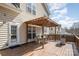 A spacious wooden back deck with outdoor seating and a grill at 148 Painted Bunting Dr, Troutman, NC 28166