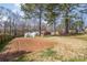 Large back yard with garden, greenhouses and trees at 148 Painted Bunting Dr, Troutman, NC 28166