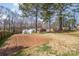 Large back yard with garden, greenhouses and trees at 148 Painted Bunting Dr, Troutman, NC 28166