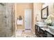 Bathroom featuring a tiled shower, a toilet, and a vanity sink with mirror at 148 Painted Bunting Dr, Troutman, NC 28166