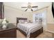 A bedroom featuring carpeted floors, a ceiling fan, and plenty of natural light at 148 Painted Bunting Dr, Troutman, NC 28166