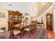 Formal dining room with a large table and hardwood flooring at 148 Painted Bunting Dr, Troutman, NC 28166