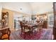 Classic dining room featuring a formal table setting and hardwood flooring at 148 Painted Bunting Dr, Troutman, NC 28166