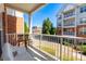 A cozy balcony with seating, overlooking the lawn and building exterior at 14941 Santa Lucia Dr, Charlotte, NC 28277