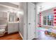 Bathroom across from the play room with vanity and a glimpse of natural light at 14941 Santa Lucia Dr, Charlotte, NC 28277