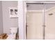 Bathroom featuring a toilet, cabinet, and glass-enclosed shower at 14941 Santa Lucia Dr, Charlotte, NC 28277
