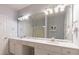 Bathroom with a long vanity, double sinks, large mirror, and a glass door shower at 14941 Santa Lucia Dr, Charlotte, NC 28277