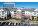 Charming multi-story condo featuring brick and white siding and convenient parking at 14941 Santa Lucia Dr, Charlotte, NC 28277