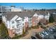 Stunning exterior elevation showcasing brick and siding, balconies, and landscaped grounds in a desirable community at 14941 Santa Lucia Dr, Charlotte, NC 28277