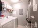 Practical laundry room with washer, dryer, shelving, and utility connections at 14941 Santa Lucia Dr, Charlotte, NC 28277