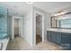 Bathroom with double vanity, a walk-in shower, and access to spacious walk-in closets at 15307 Country Lake Dr, Pineville, NC 28134