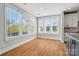 Bright breakfast nook with hardwood floors and large windows at 15307 Country Lake Dr, Pineville, NC 28134