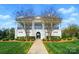 Stately community clubhouse featuring white columns, manicured landscaping and welcoming entrance at 15307 Country Lake Dr, Pineville, NC 28134
