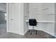 A small office features floating shelves, a built in desk, and a modern office chair at 15307 Country Lake Dr, Pineville, NC 28134